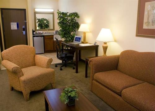 Studio Suite Sitting area with pull out sofa and kitchenette Studio Suite Sitting area with pull out sofa and kitchenette